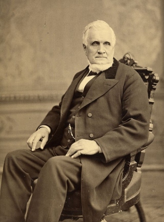 John_Taylor_seated_in_chair (471x640)
